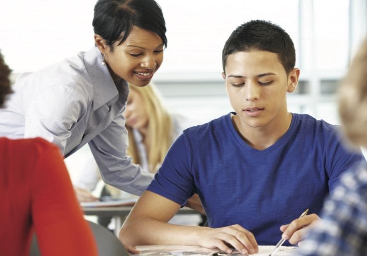 Teacher helping student